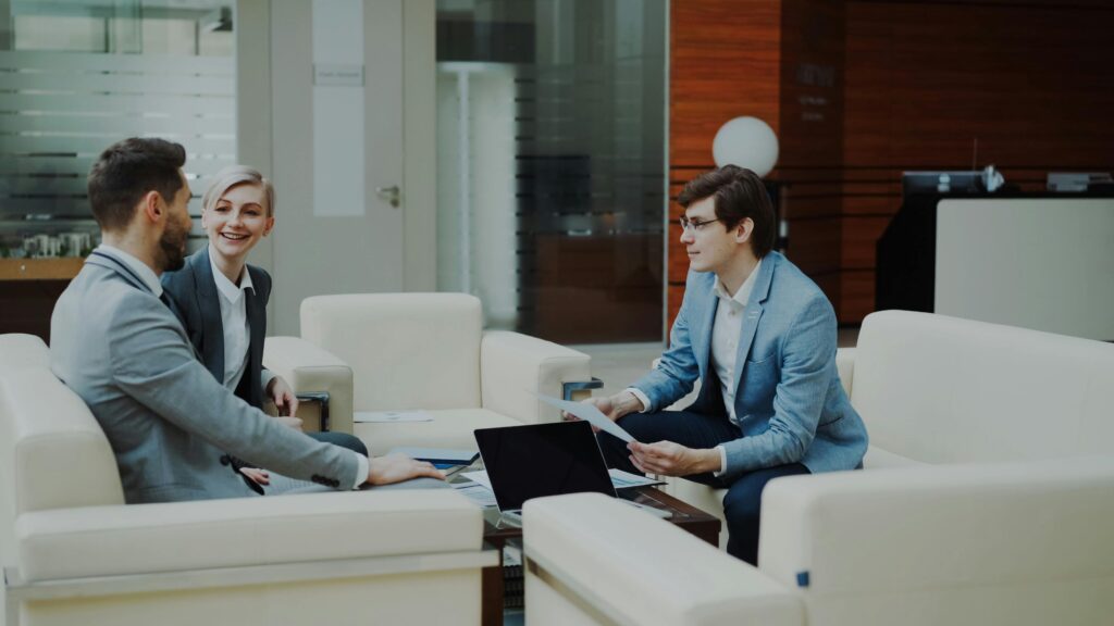 Group of professionals having a productive business meeting in a modern office setting.